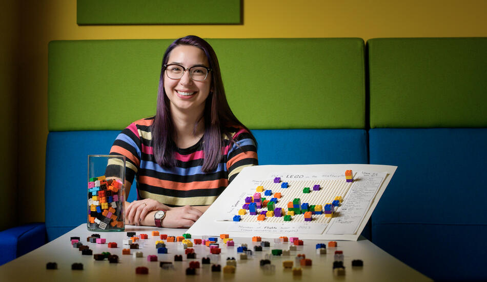 Photograph of Elsie with the LEGO data visualization